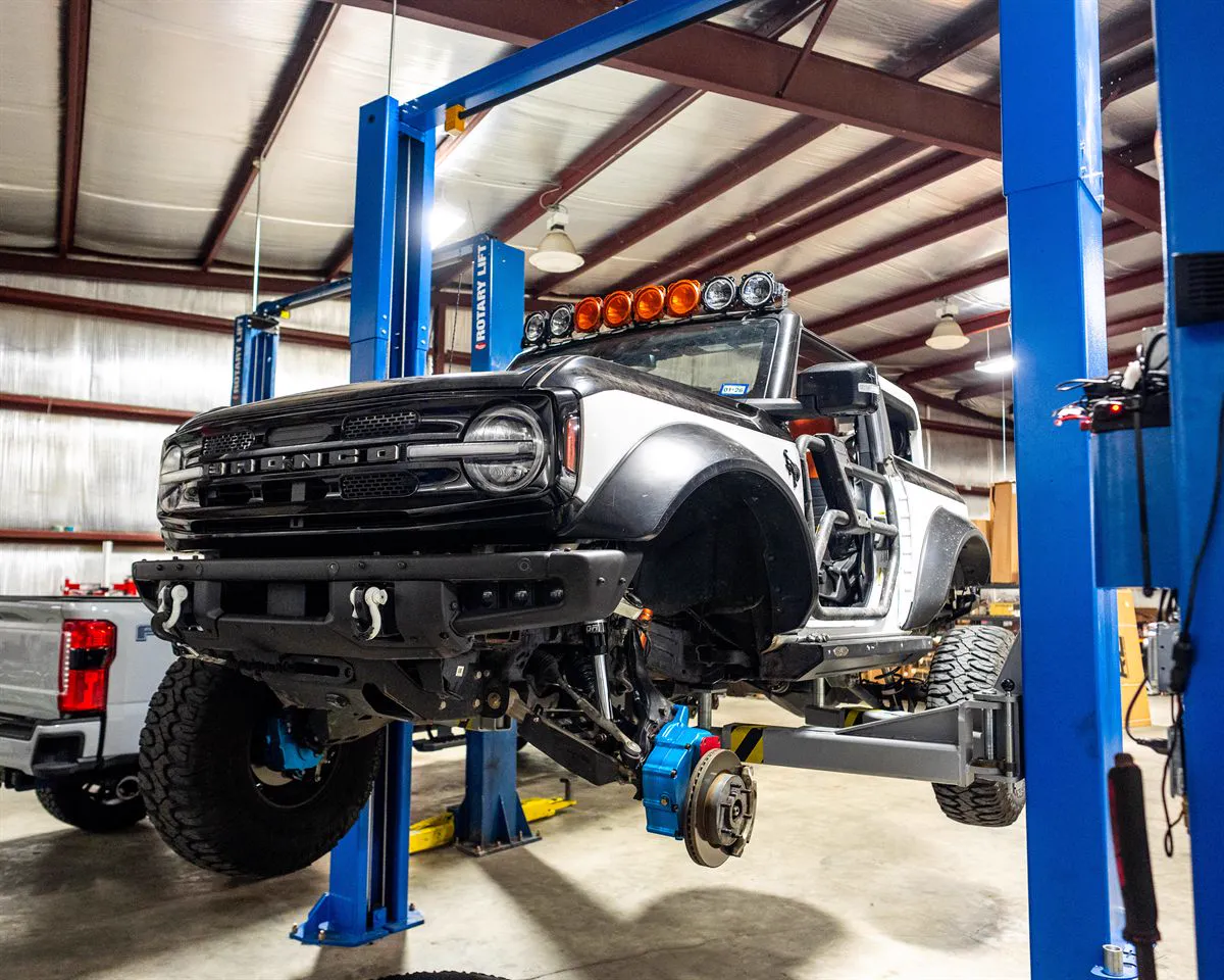 Ford Bronco build with roof light bar and 35-inch tires on the lift